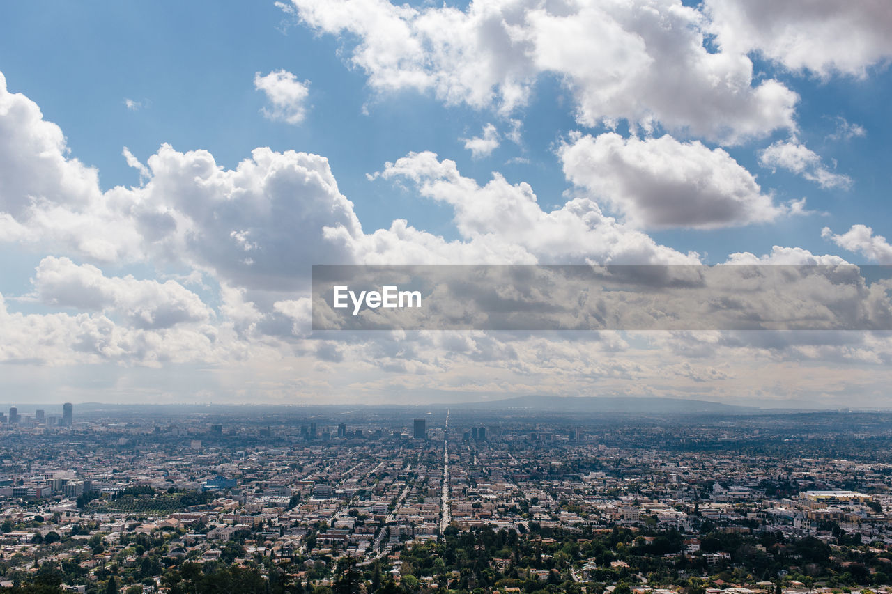 Aerial view of cityscape against sky