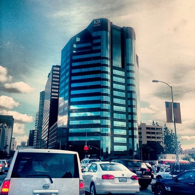 LOW ANGLE VIEW OF MODERN BUILDINGS AGAINST CLEAR SKY