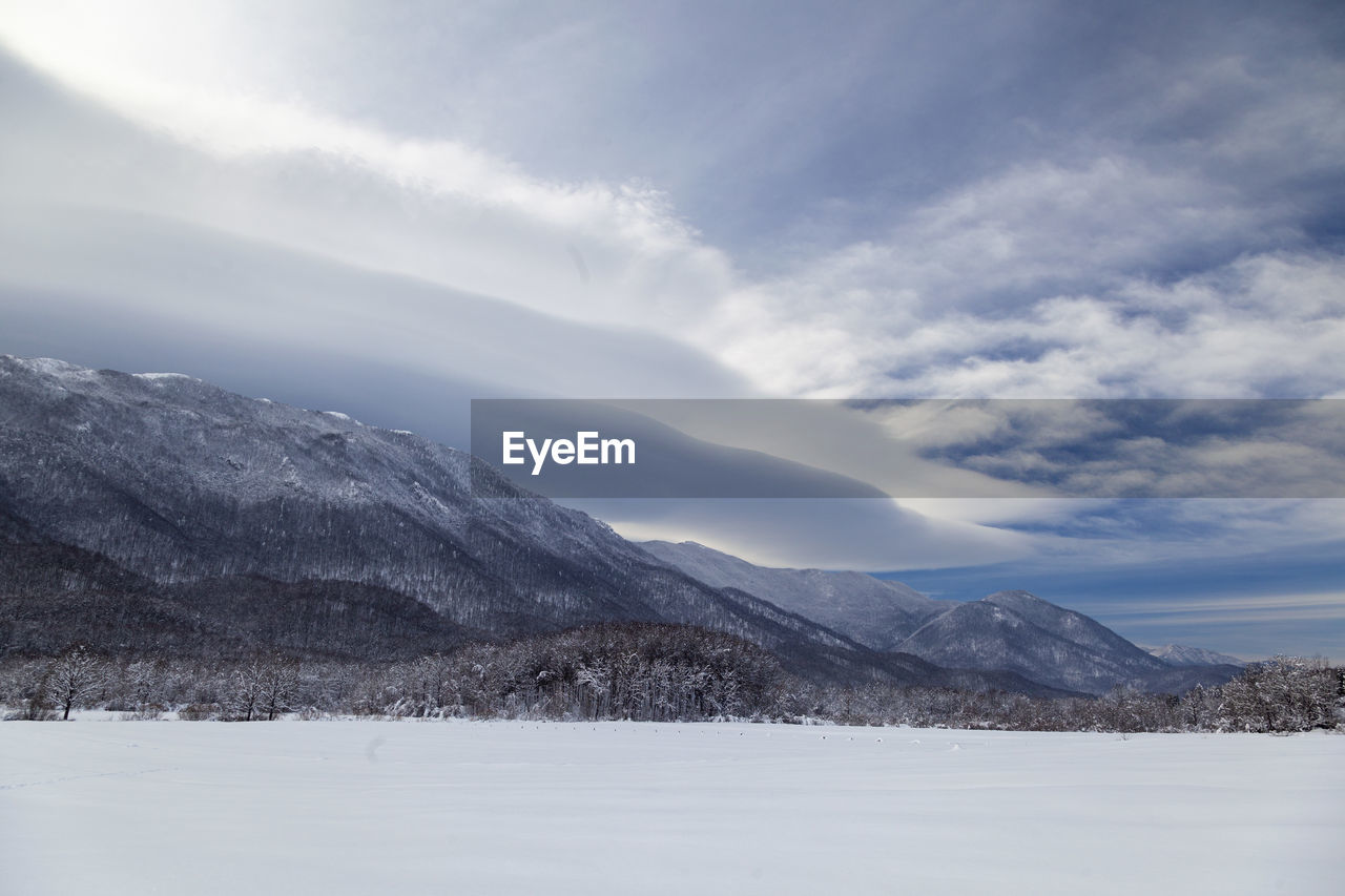 Scenic view of snowcapped mountains against sky