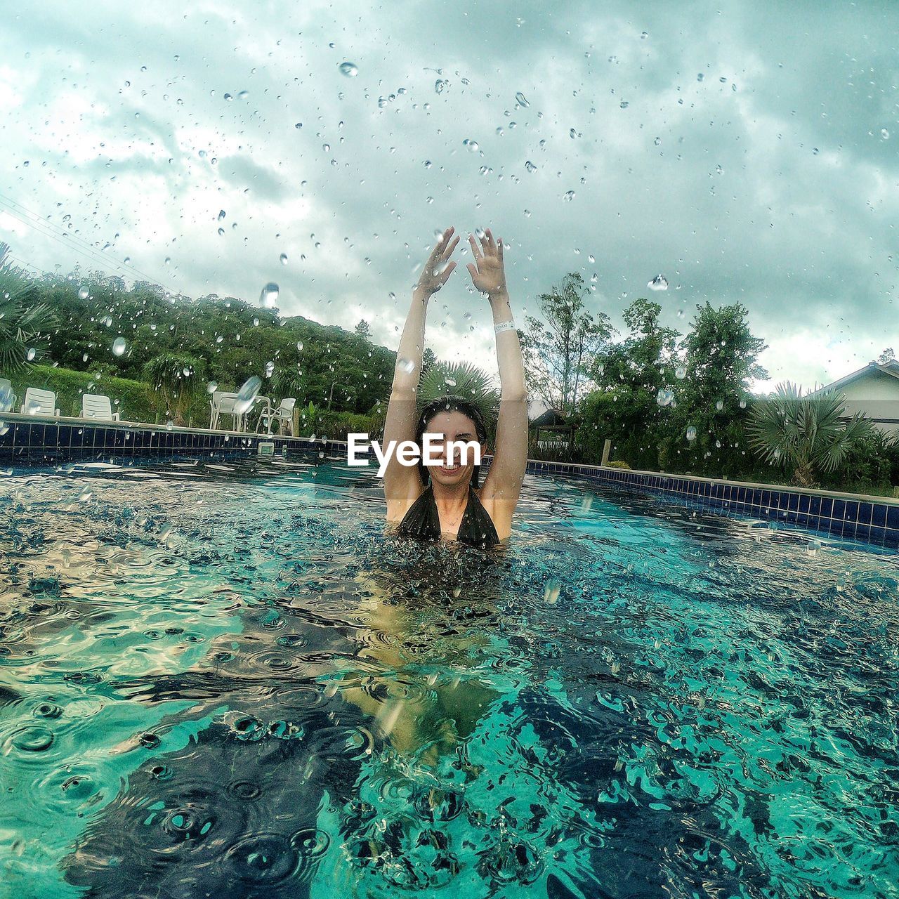 FULL LENGTH OF MAN SWIMMING IN POOL