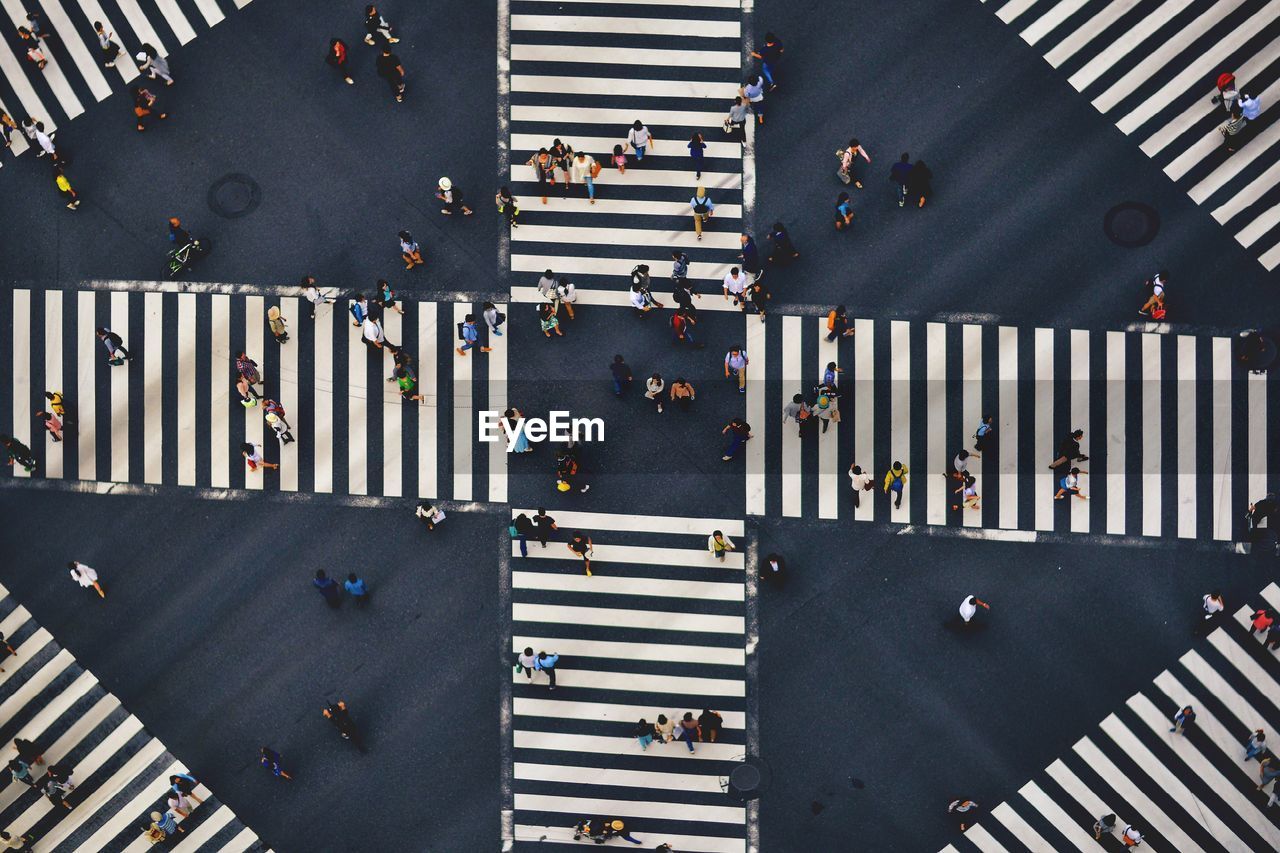 High angle view of people walking on city street