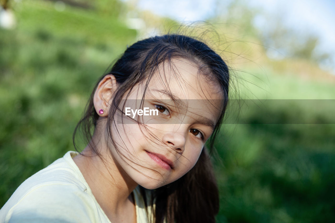 CLOSE-UP PORTRAIT OF GIRL WITH HAIR