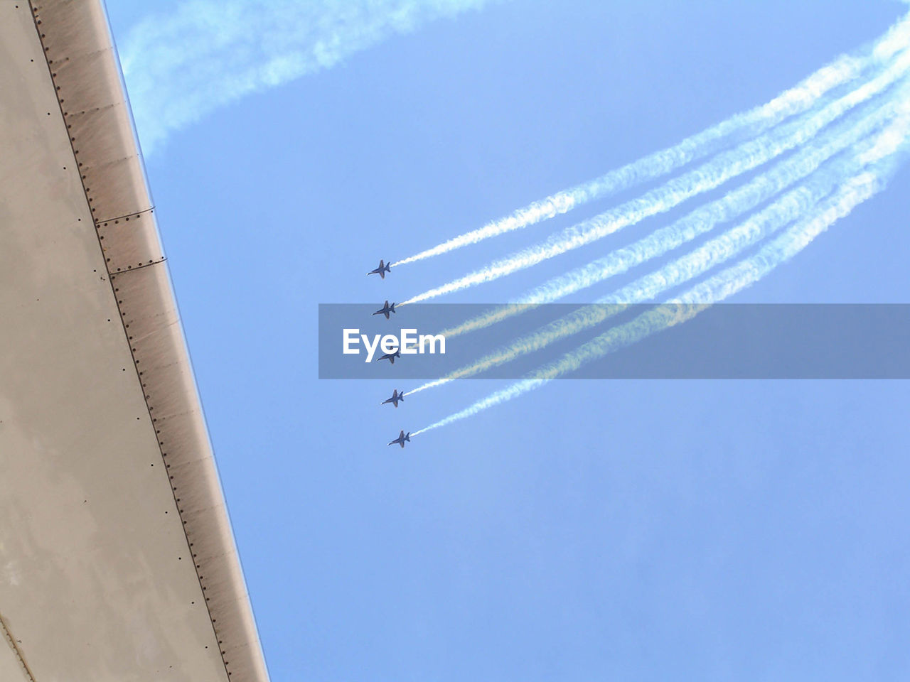 Low angle view of airplane flying in sky