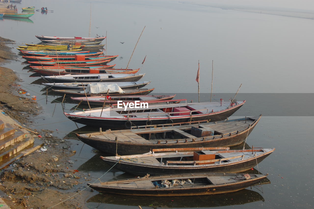 Boats moored in water