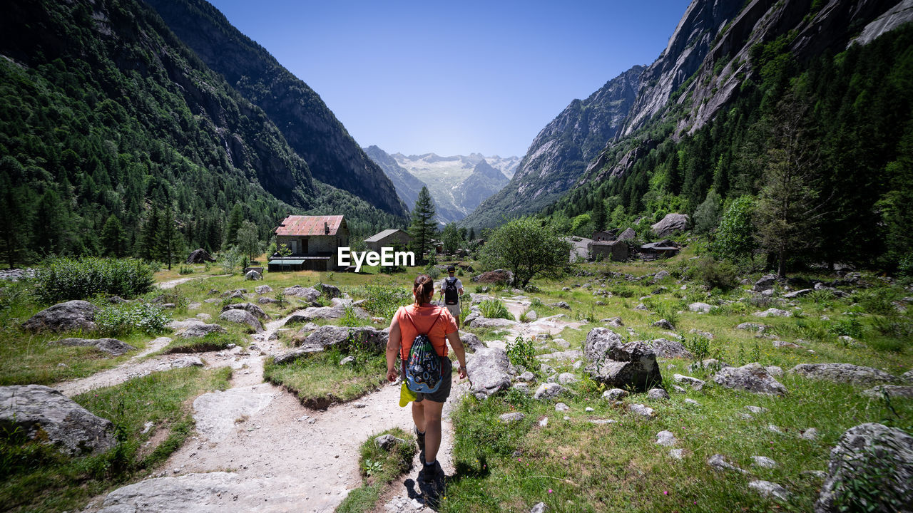 Rear view of man walking on mountain