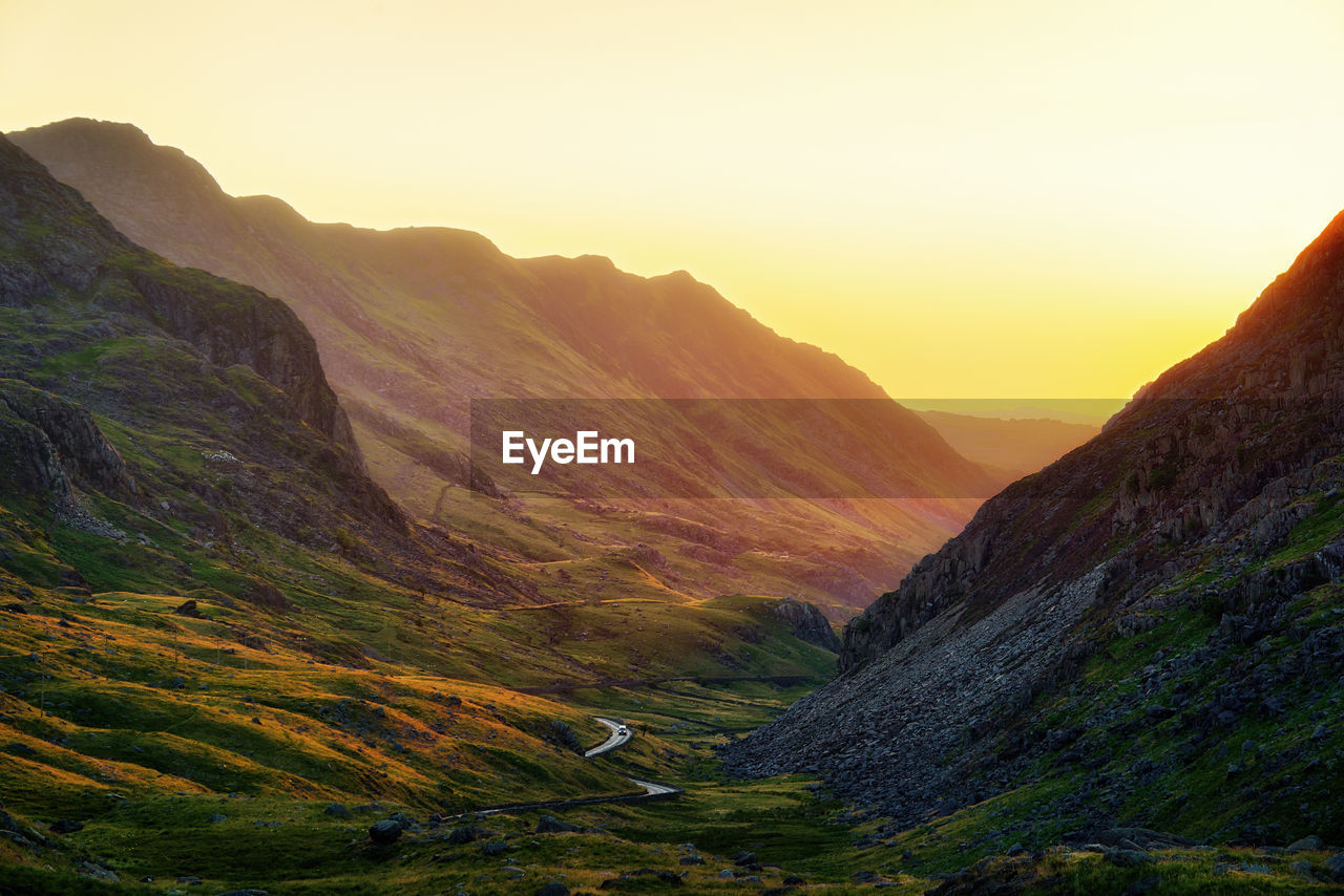 Scenic view of mountains against sky during sunset