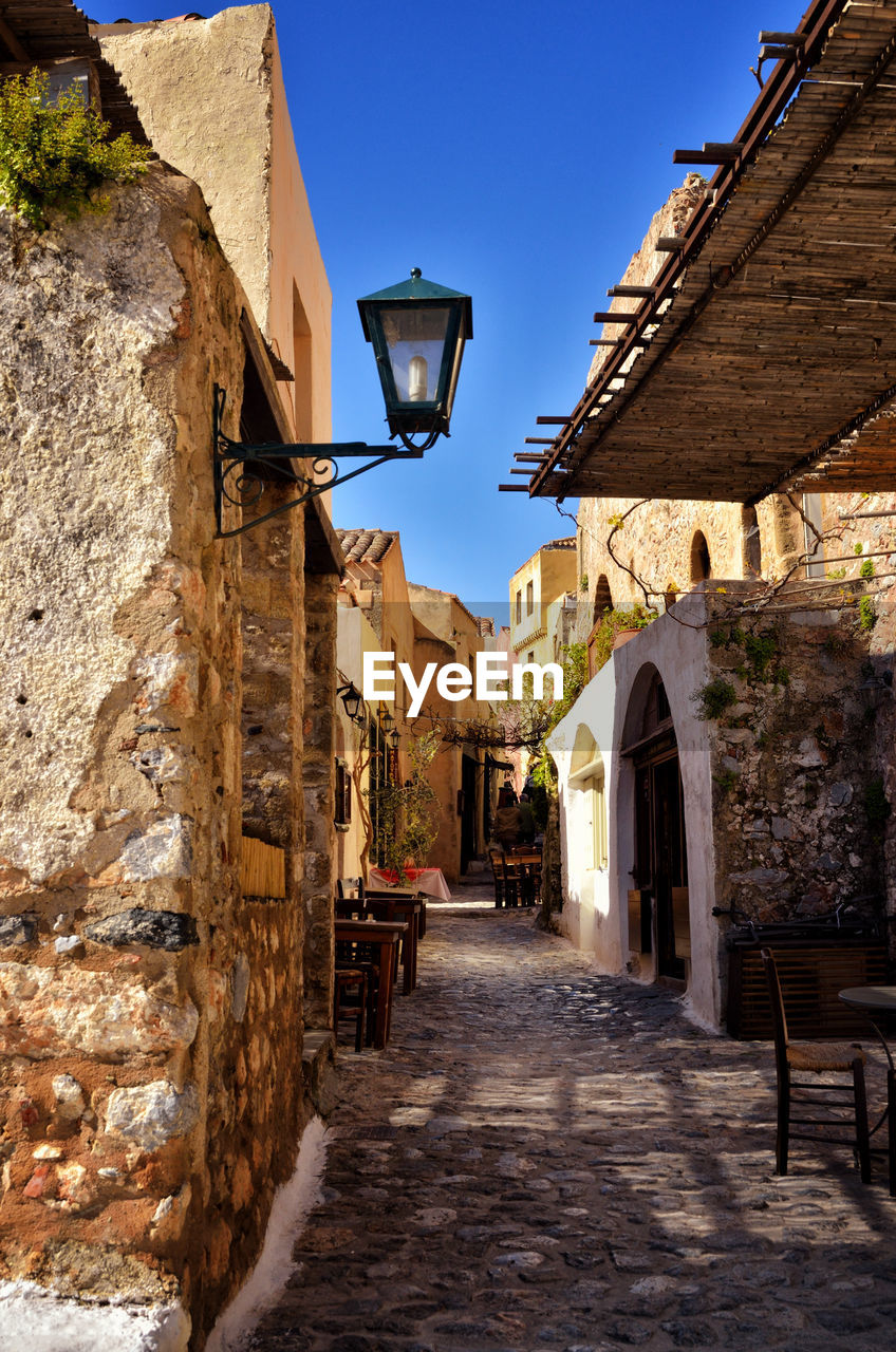 Narrow alley amidst buildings in city