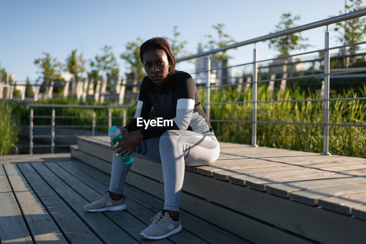 Black runner with water resting on step