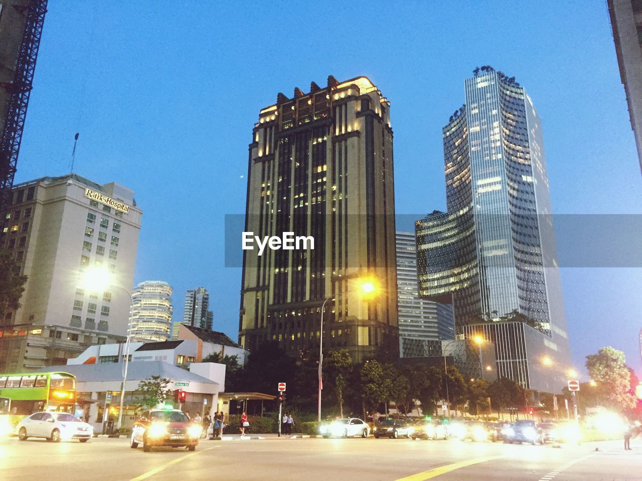 Low angle view of illuminated buildings against blue sky