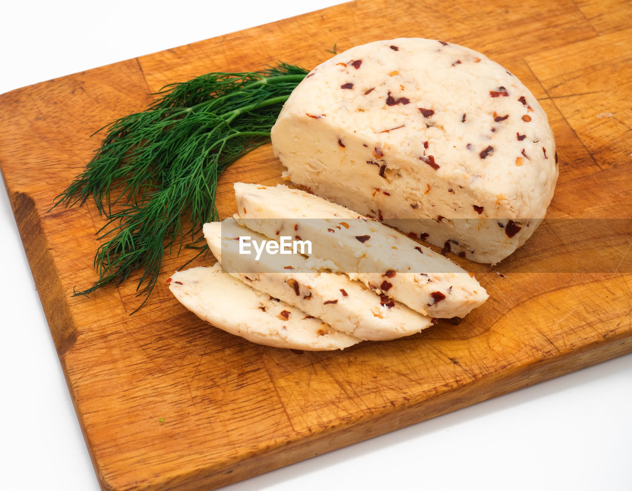 Close-up of sliced food on cutting board at table