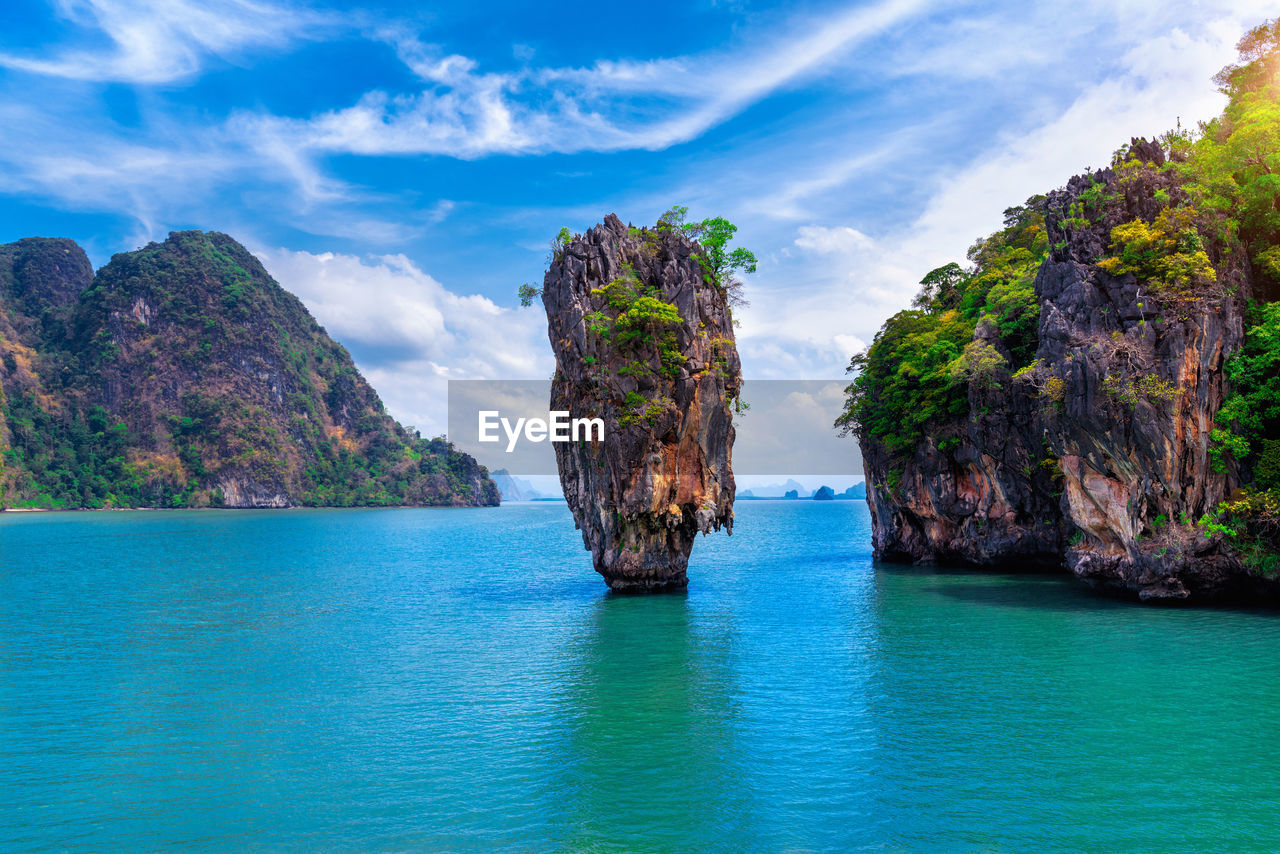 SCENIC VIEW OF SEA AGAINST ROCK FORMATION