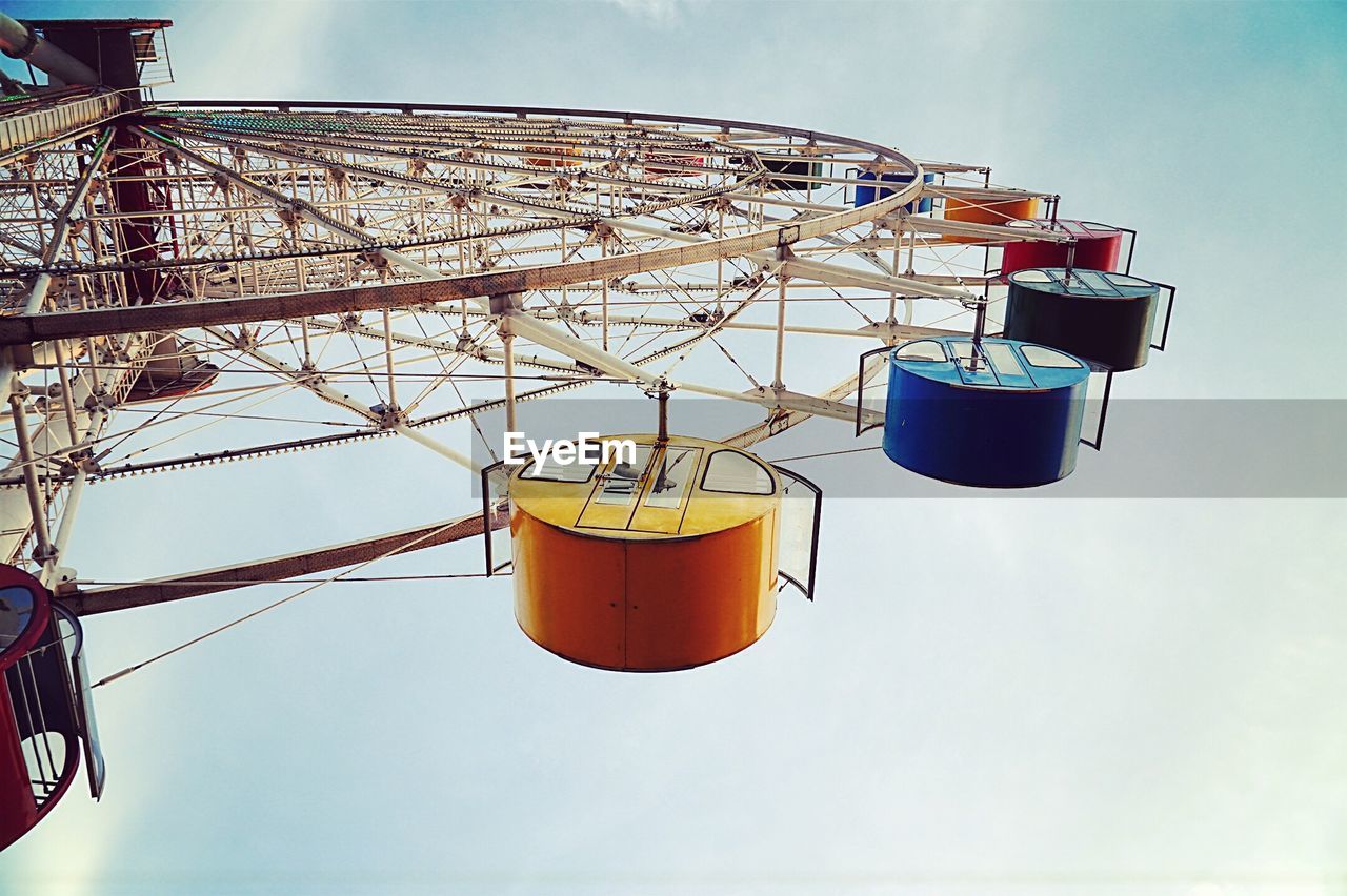 Low angle view of ferris wheel against clear sky