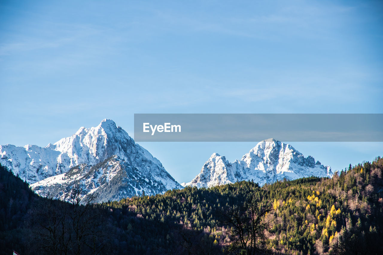 Scenic view of snowcapped mountains against sky