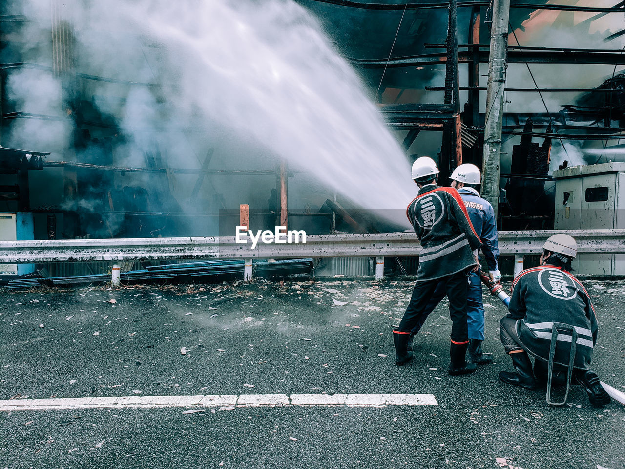 PEOPLE WORKING ON STREET