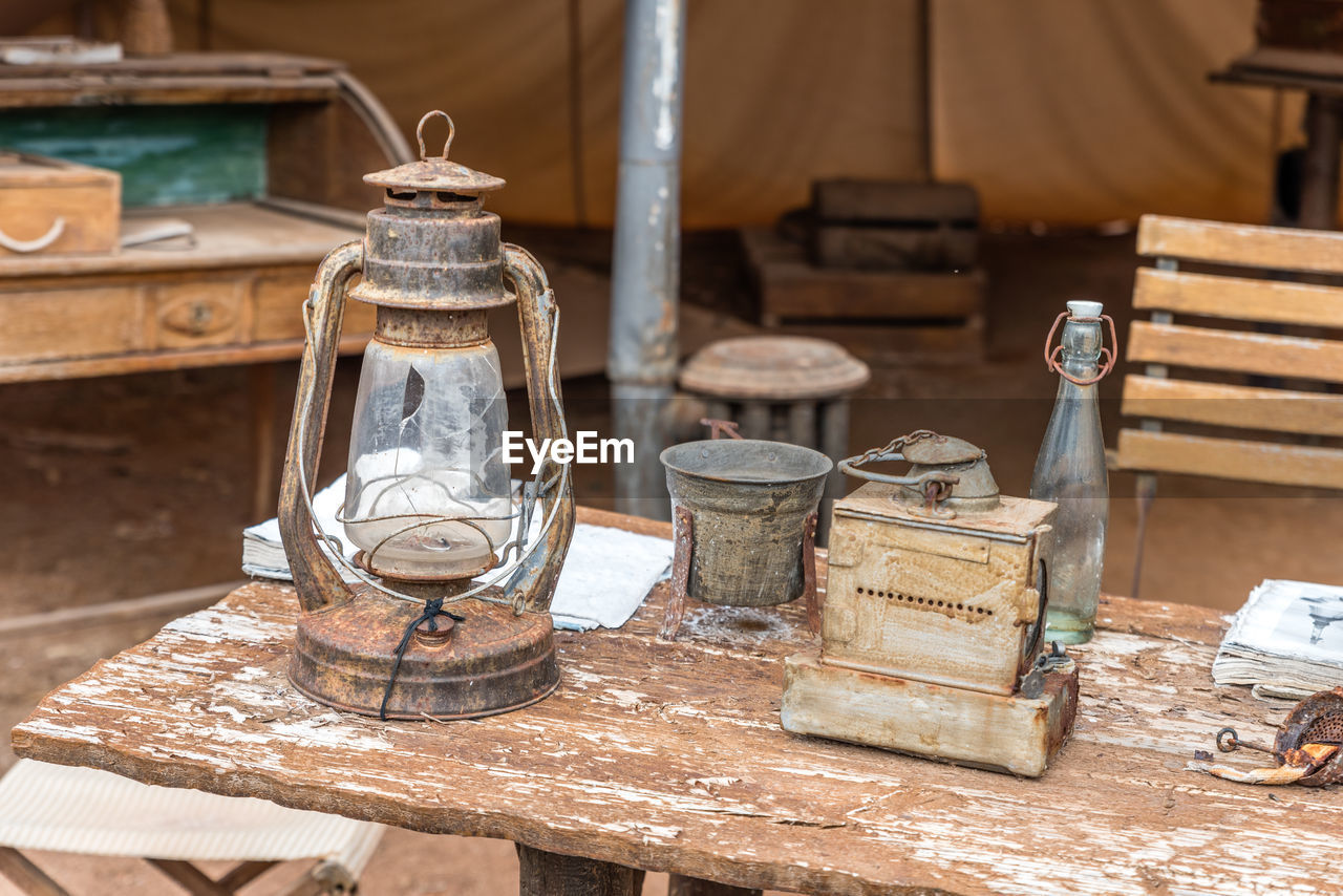 Close-up of old lamp on table