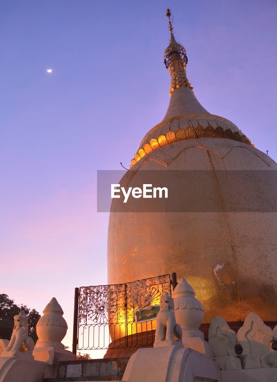 Low angle view of mosque against sky at dusk