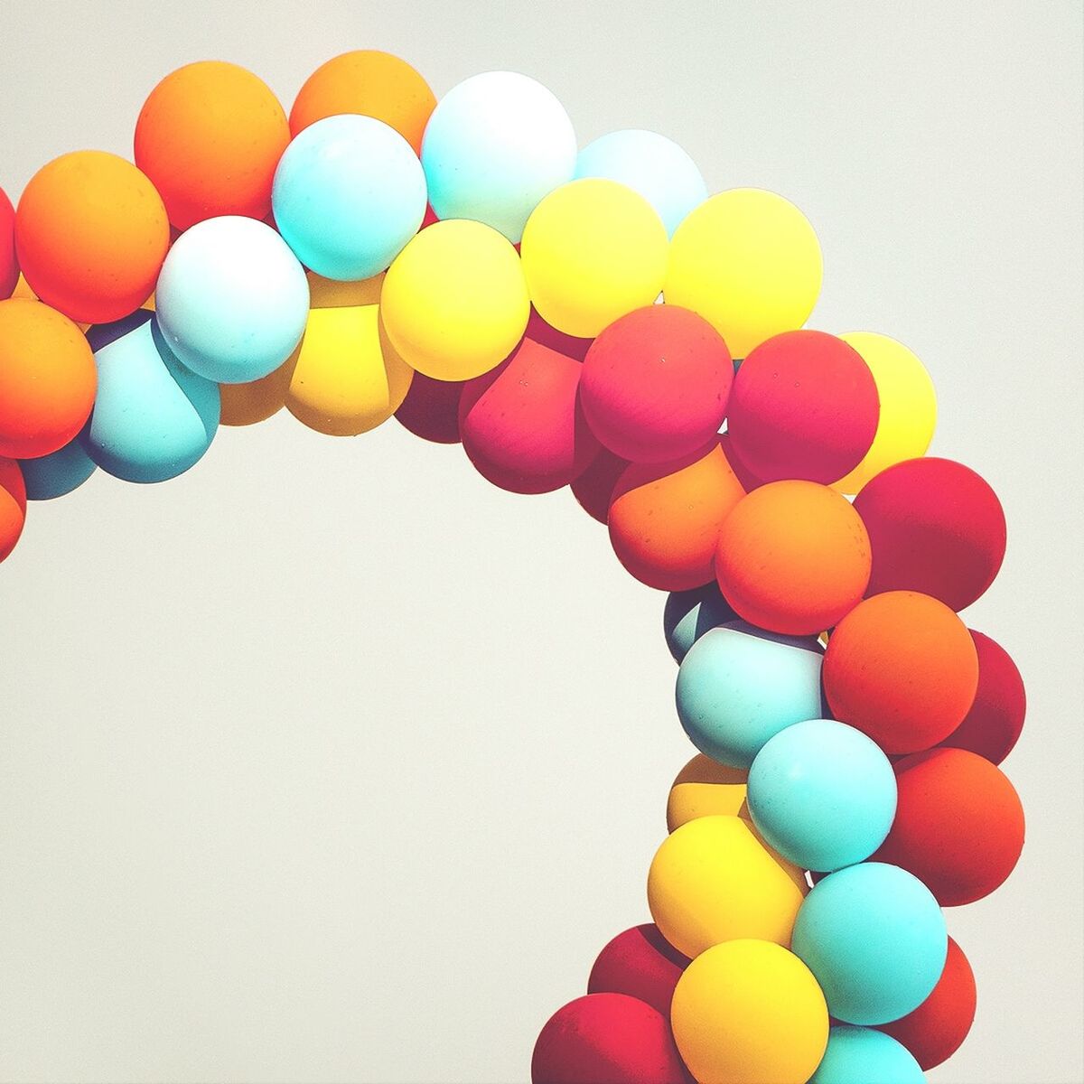 LOW ANGLE VIEW OF COLORFUL BALLOONS HANGING ON BALLOONS