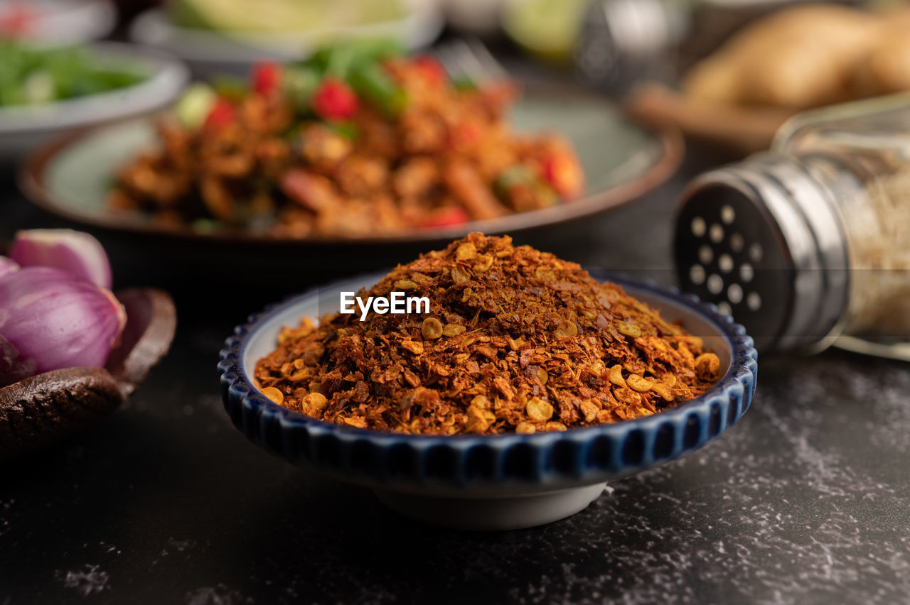 CLOSE-UP OF MEAT ON TABLE