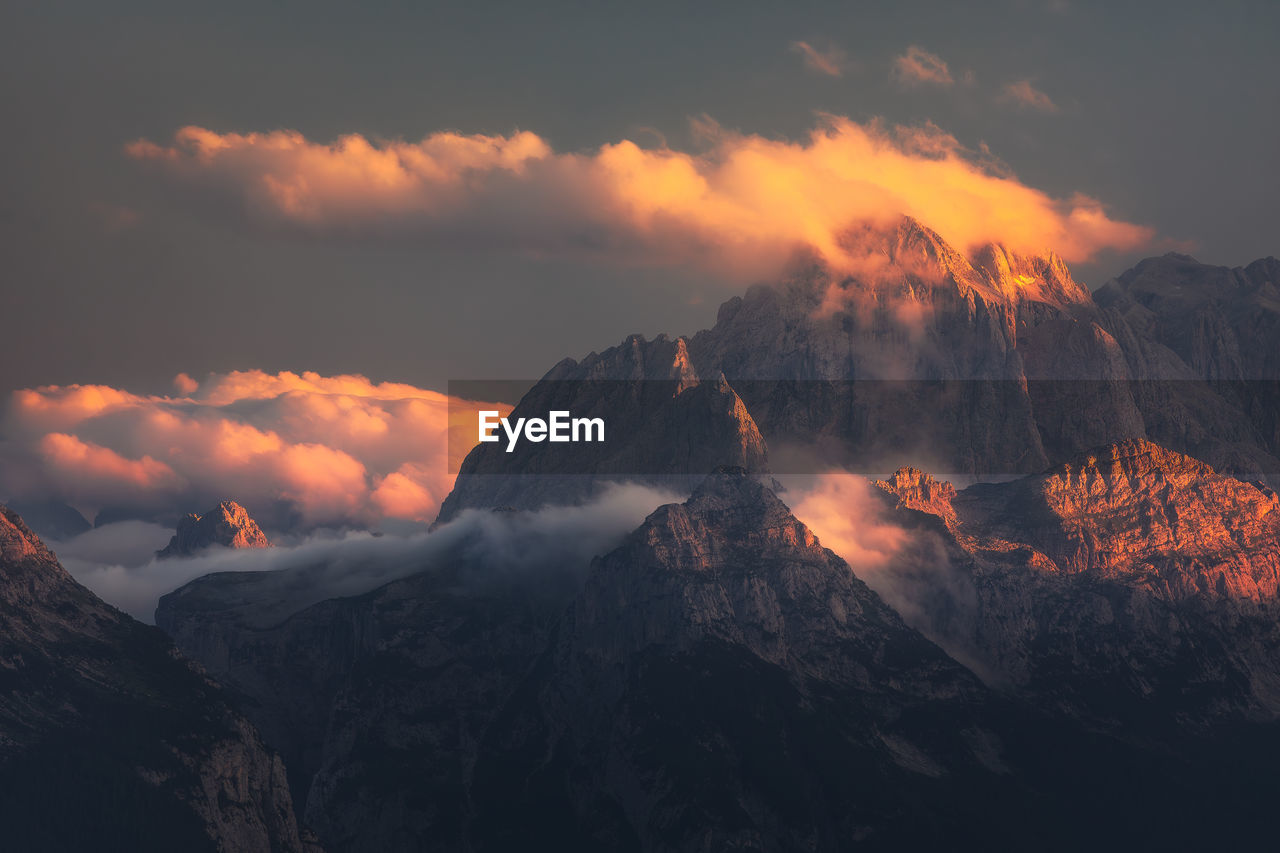 Moody landscape with dolomite mountains in perfect sunset light.