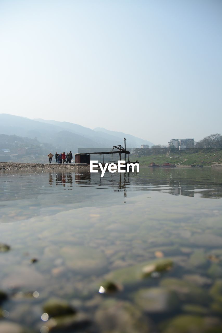 Scenic view of calm sea against clear blue sky