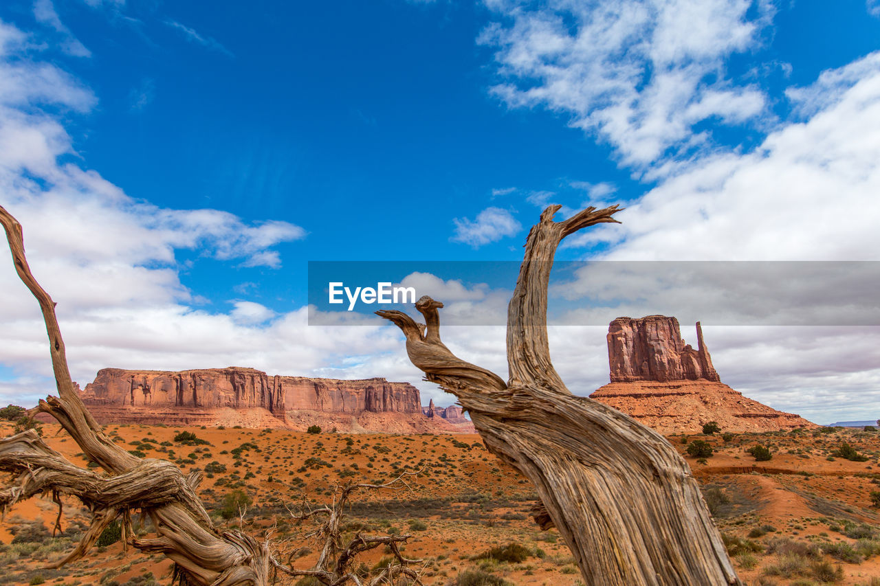 Low angle view of rock formation against cloudy sky