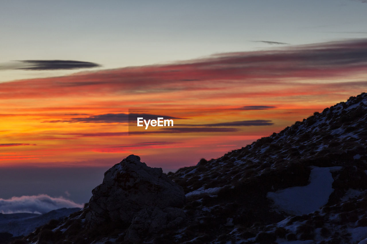 Scenic view of dramatic sky during sunset