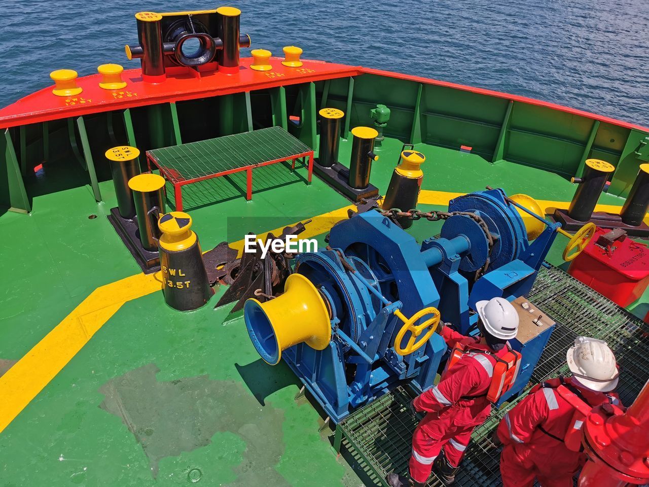 High angle view of men in nautical vessel on sea