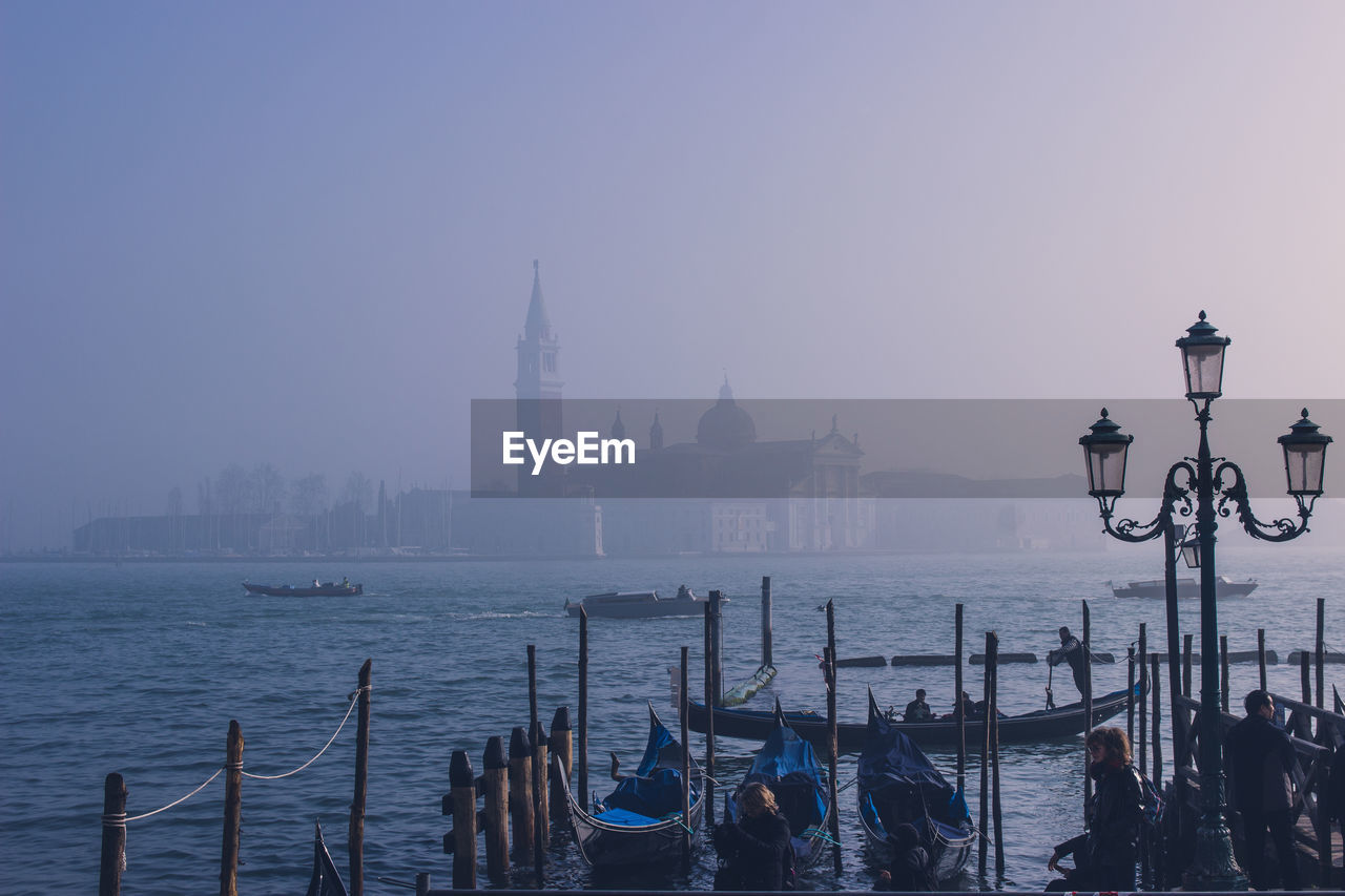 Panoramic view of sea and buildings against sky