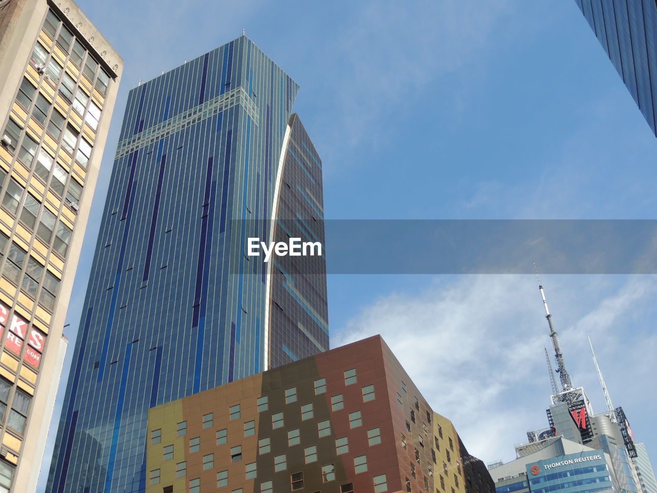 LOW ANGLE VIEW OF MODERN BUILDINGS AGAINST SKY