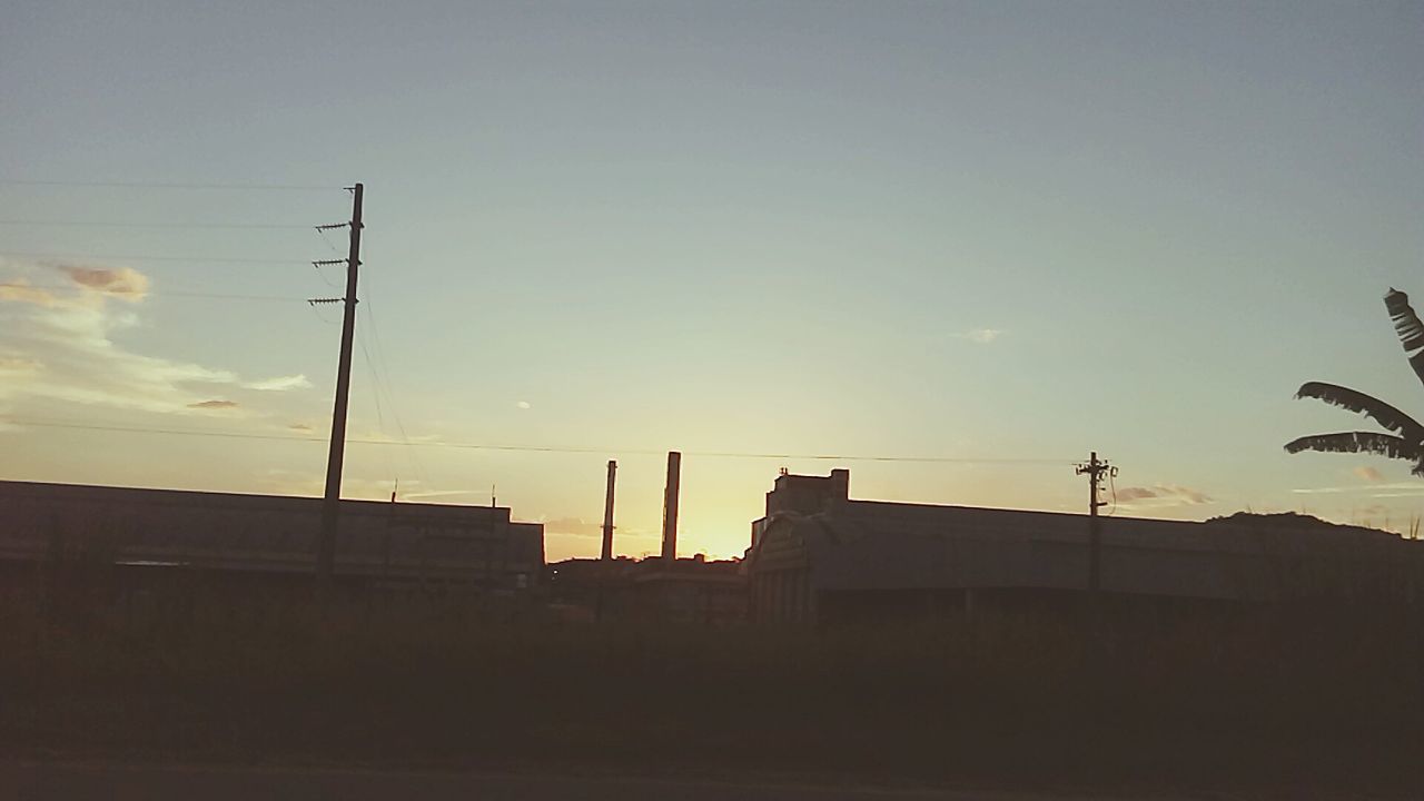 LOW ANGLE VIEW OF SILHOUETTE BUILDING AGAINST SKY DURING SUNSET