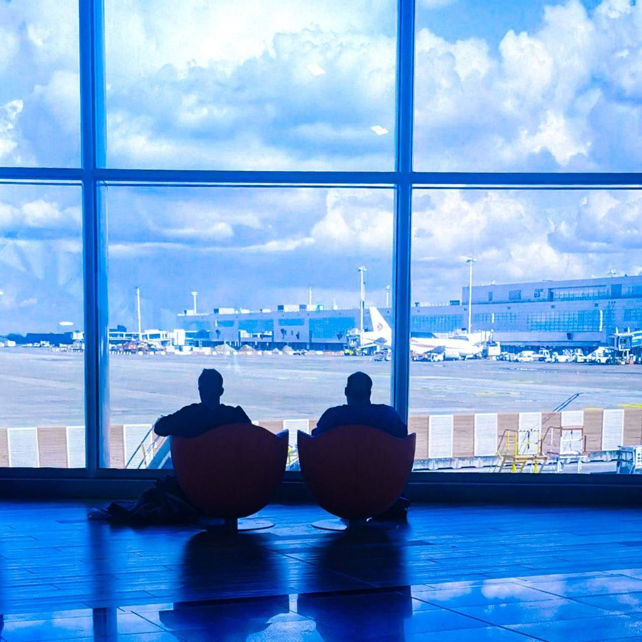 blue, window, reflection, cloud, adult, indoors, nature, sky, sitting, architecture, men, relaxation, two people, city, cityscape, women, water, lifestyles, glass, day, travel, looking, silhouette, rear view, business