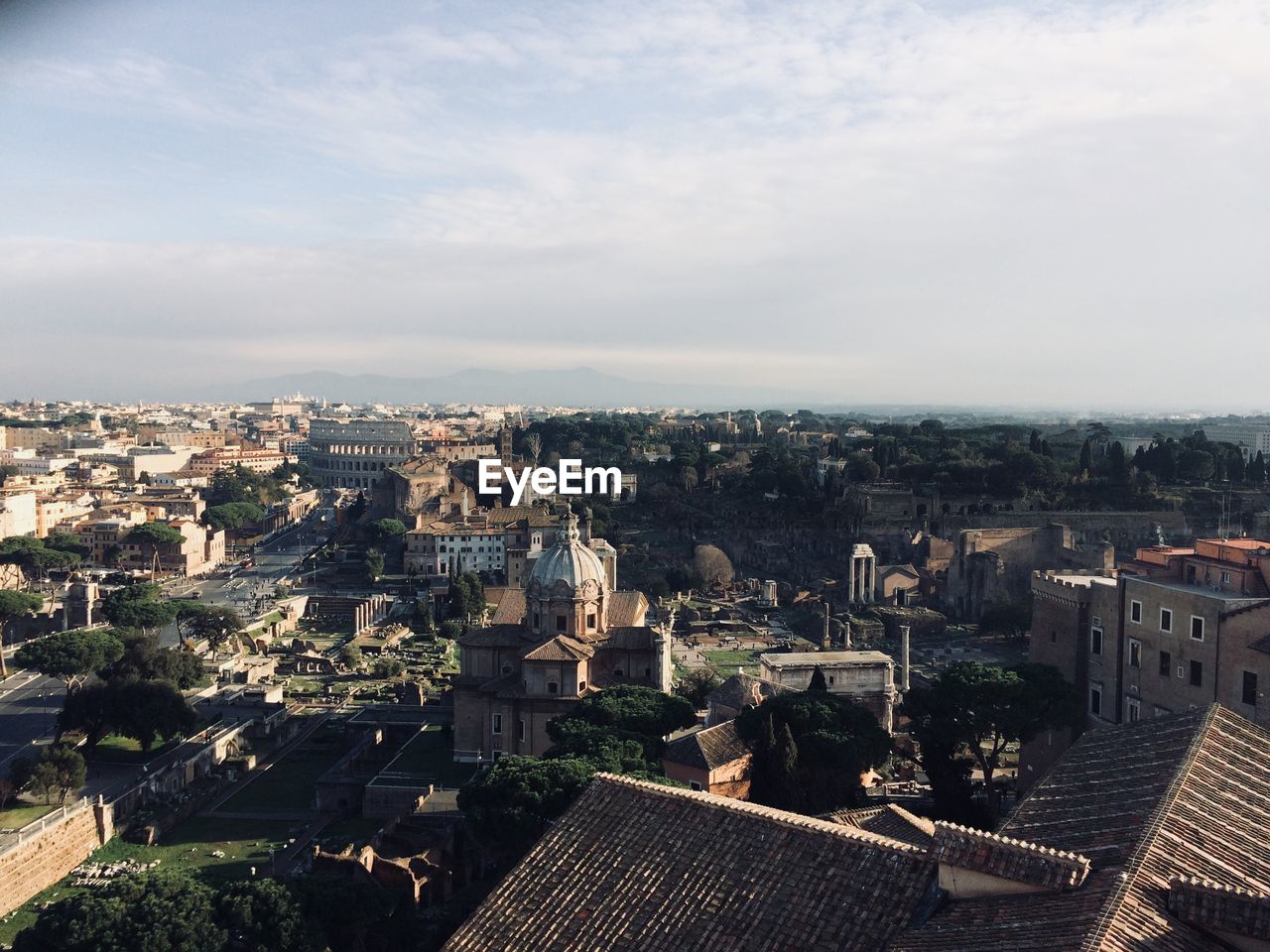 HIGH ANGLE VIEW OF CITY AGAINST SKY