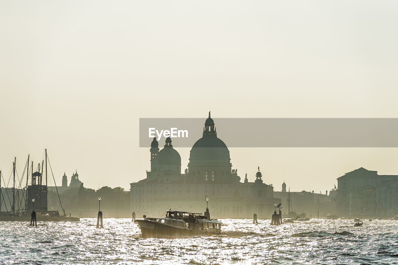 Santa maria della salute by grand canal against sky