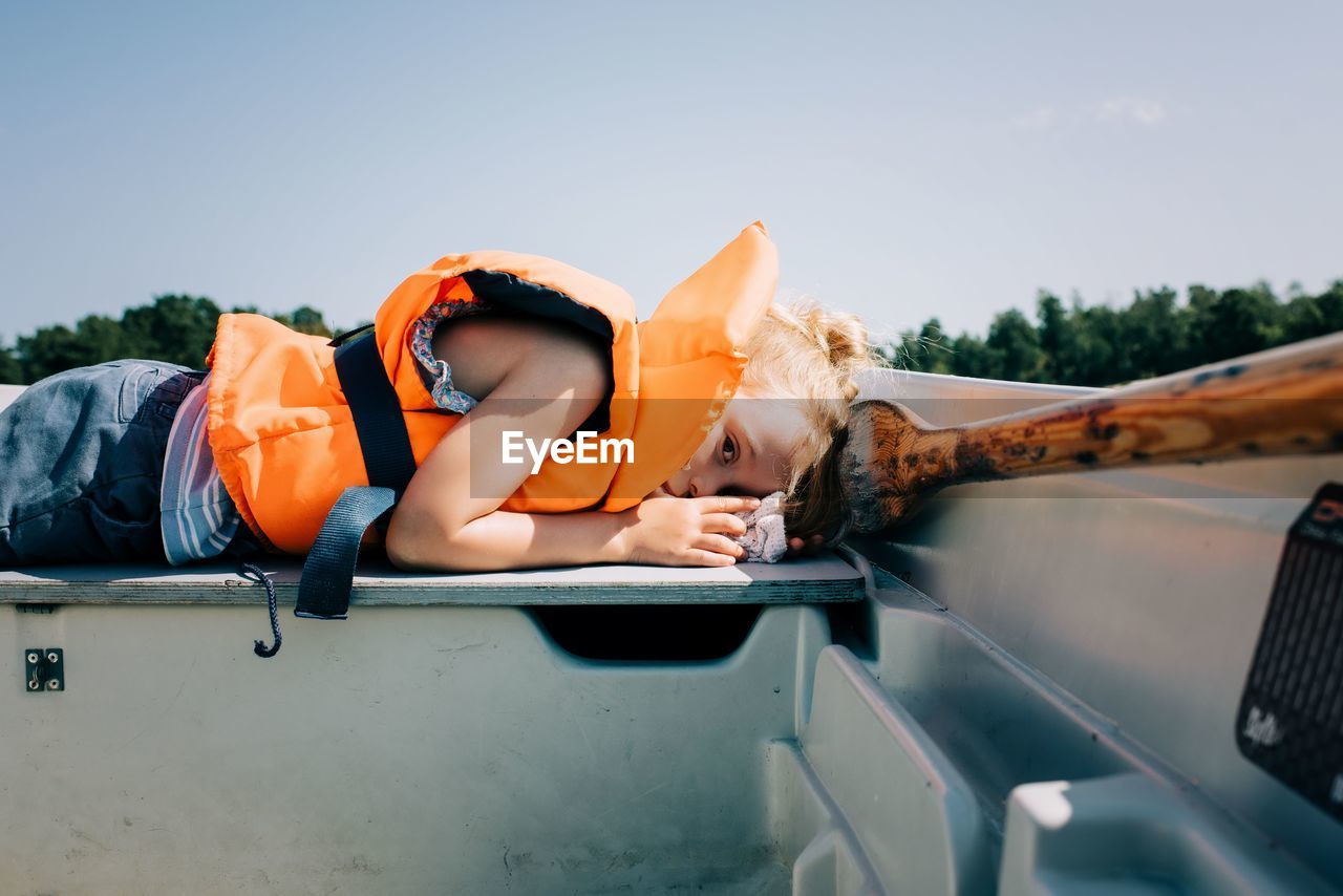 Young girl sleeping on a boat in sweden in summer