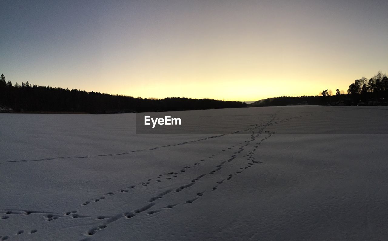 Scenic view of snow covered landscape against sky