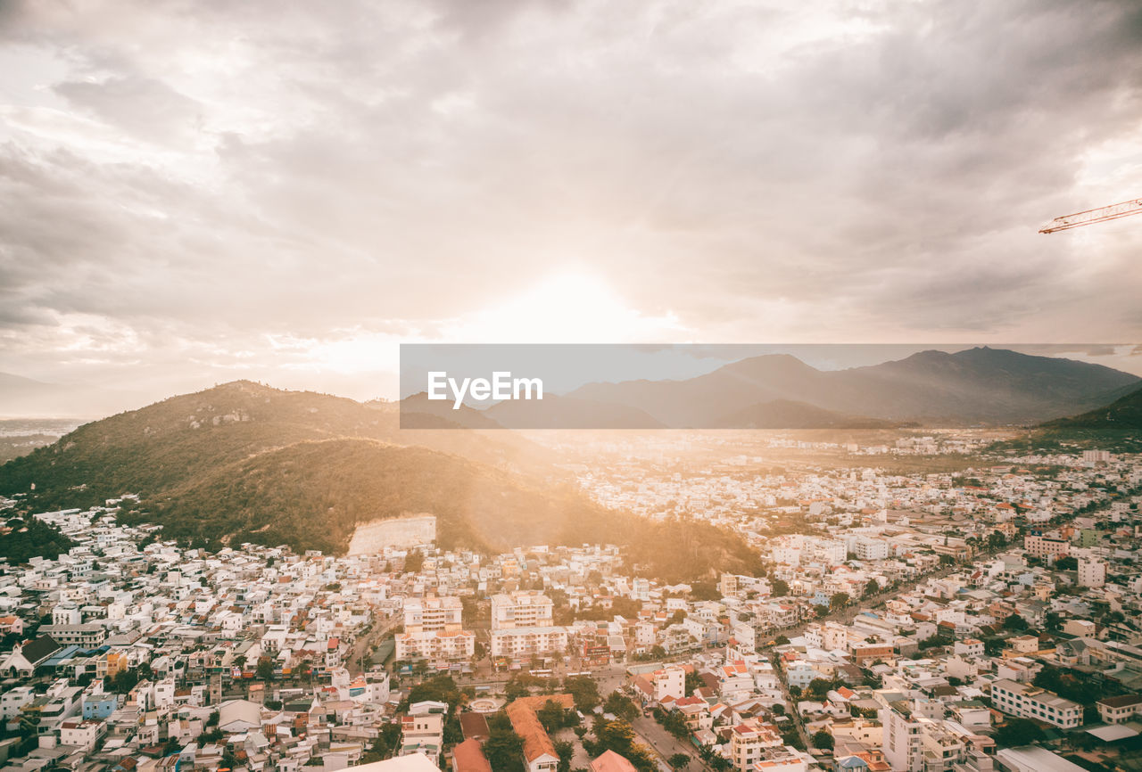 Aerial view of townscape against sky during sunset