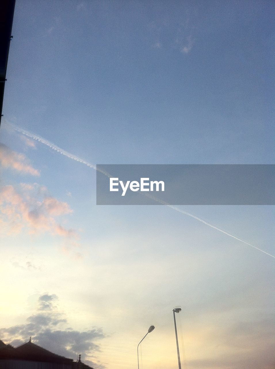 LOW ANGLE VIEW OF VAPOR TRAILS IN SKY