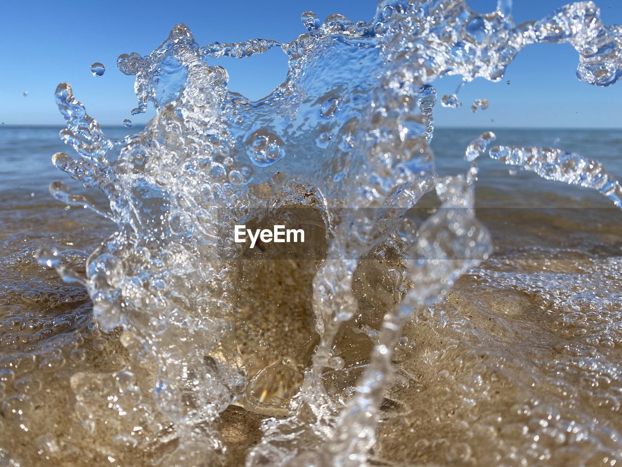 CLOSE-UP OF SPLASHING WATER IN SEA