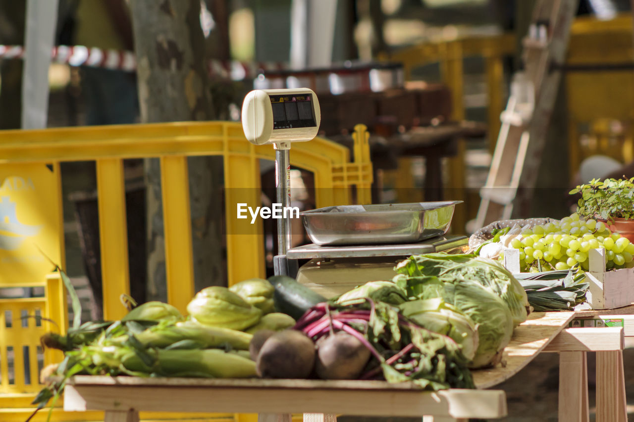 Various vegetables and fruits for sale at market stall