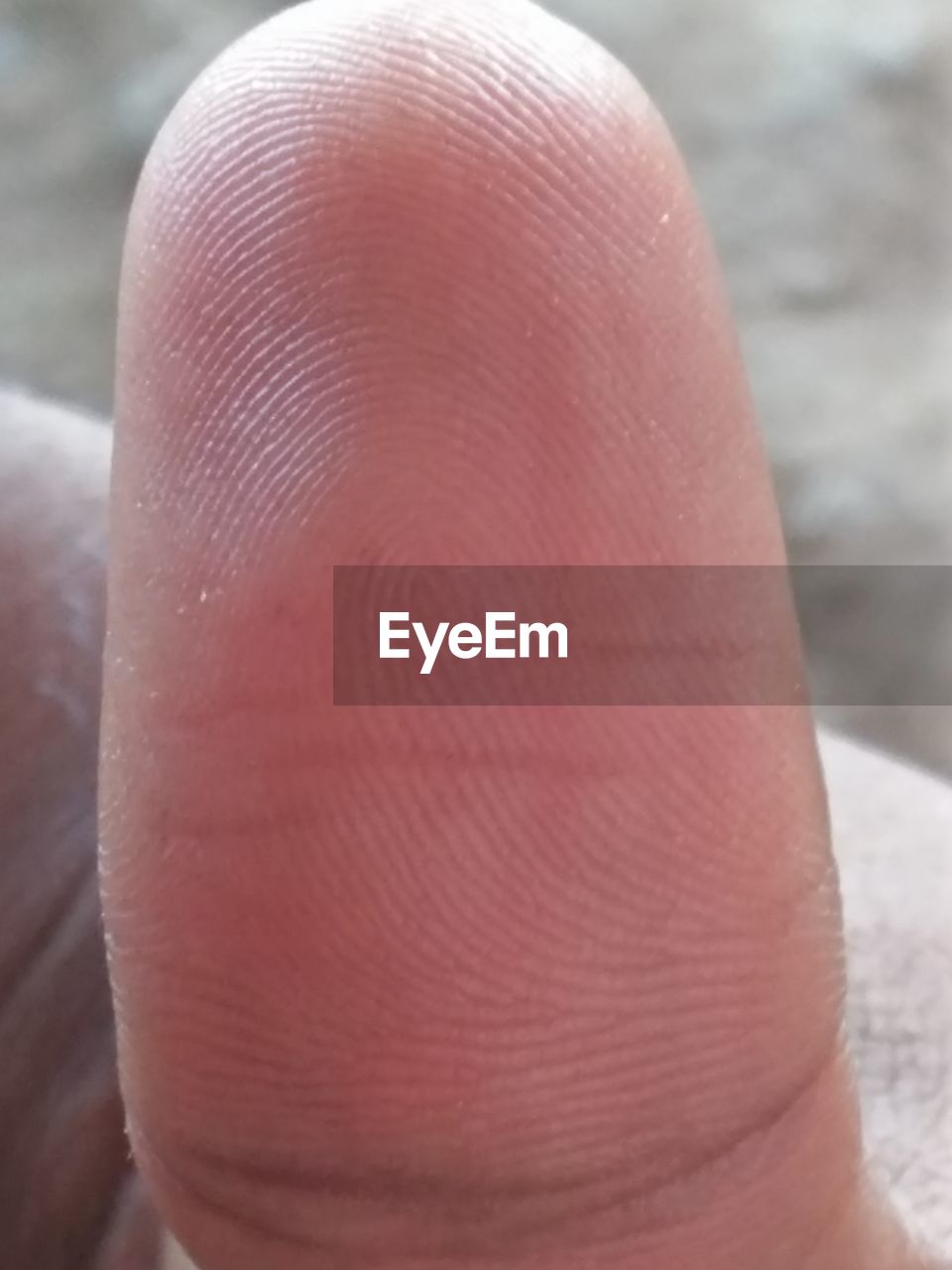 CLOSE-UP OF HUMAN HAND ON FINGER