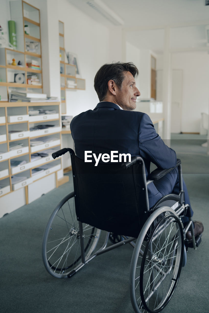 Disabled businessman sitting in wheelchair