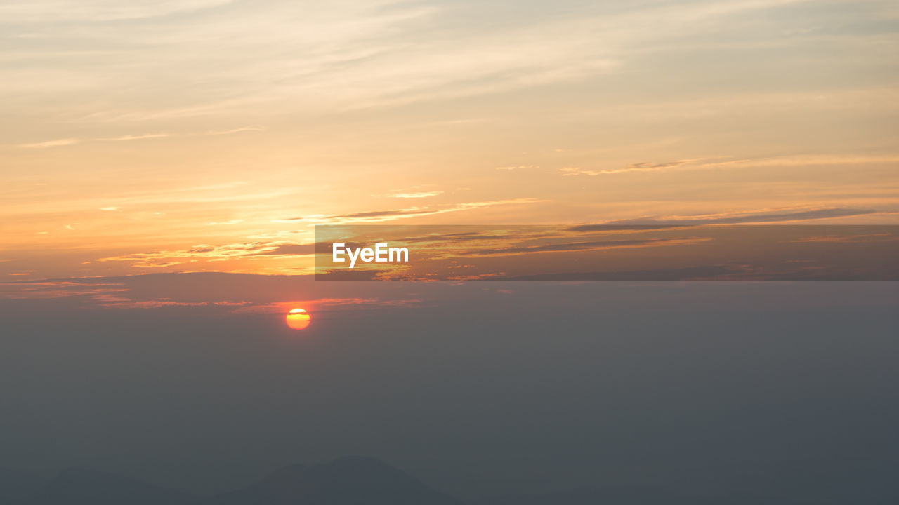 SCENIC VIEW OF DRAMATIC SKY OVER SILHOUETTE LANDSCAPE