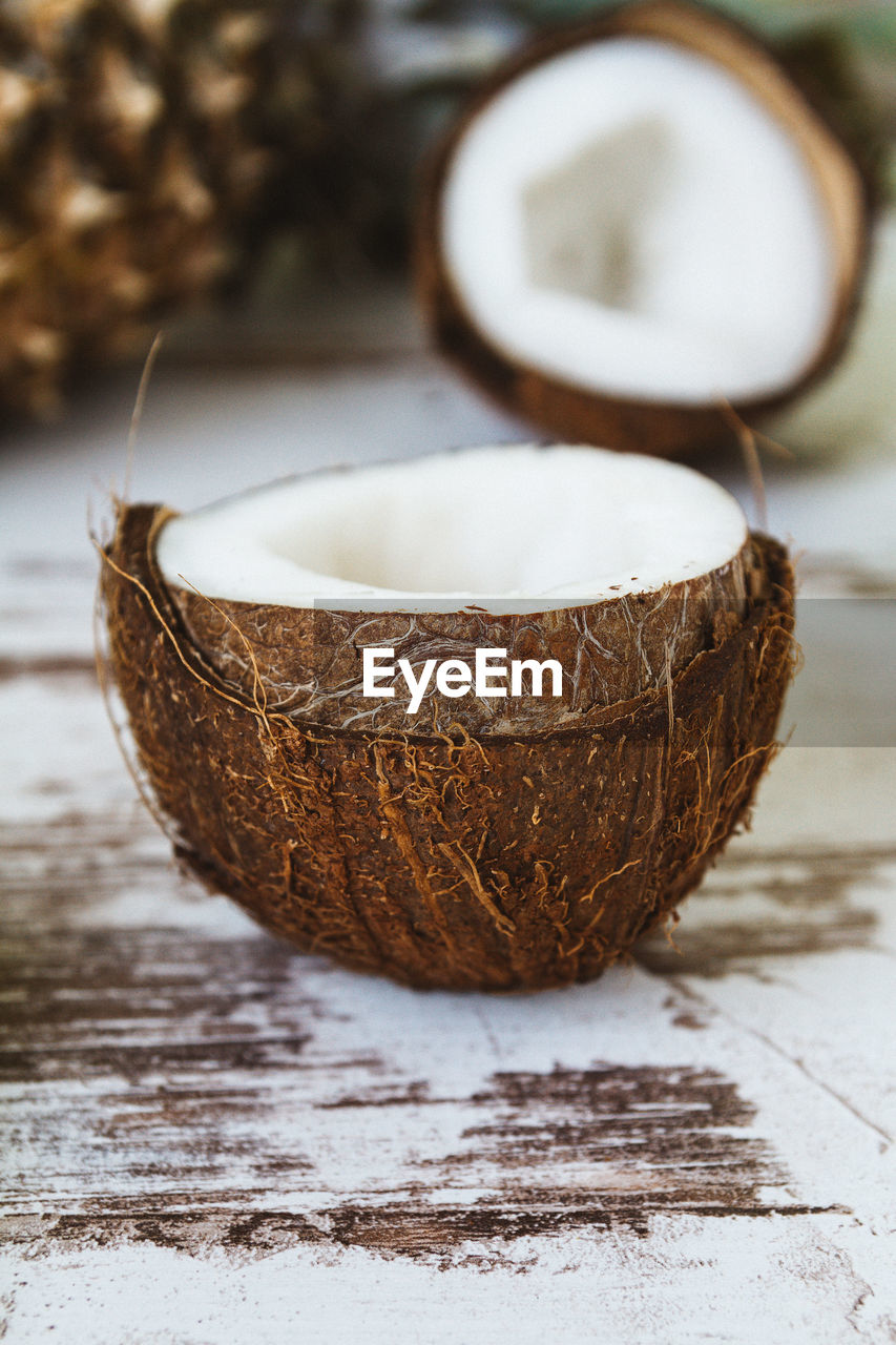 Fresh raw coconut on the wooden rustic table