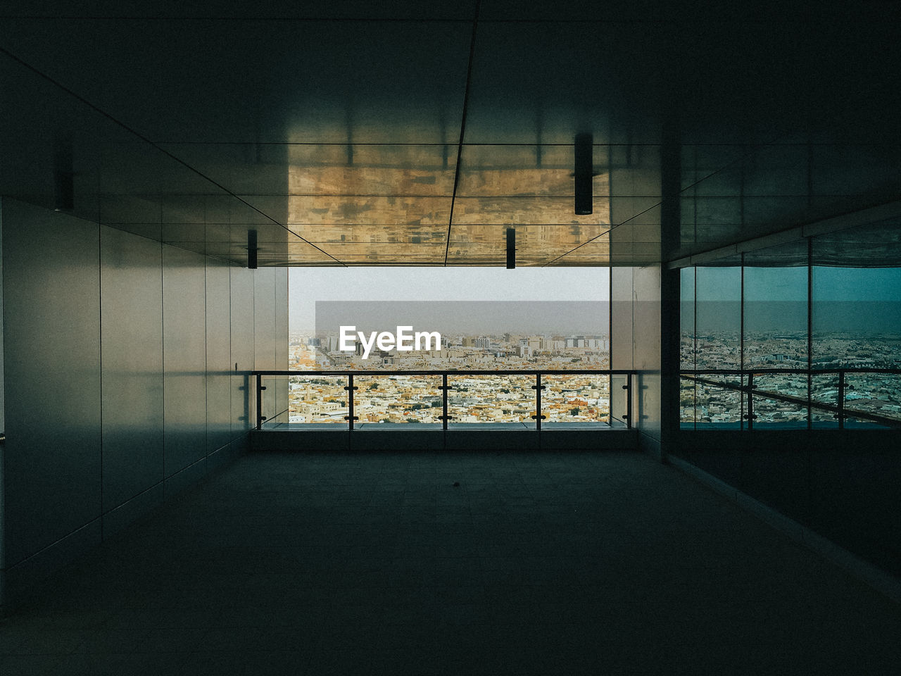 Scenic view of cityscape through balcony