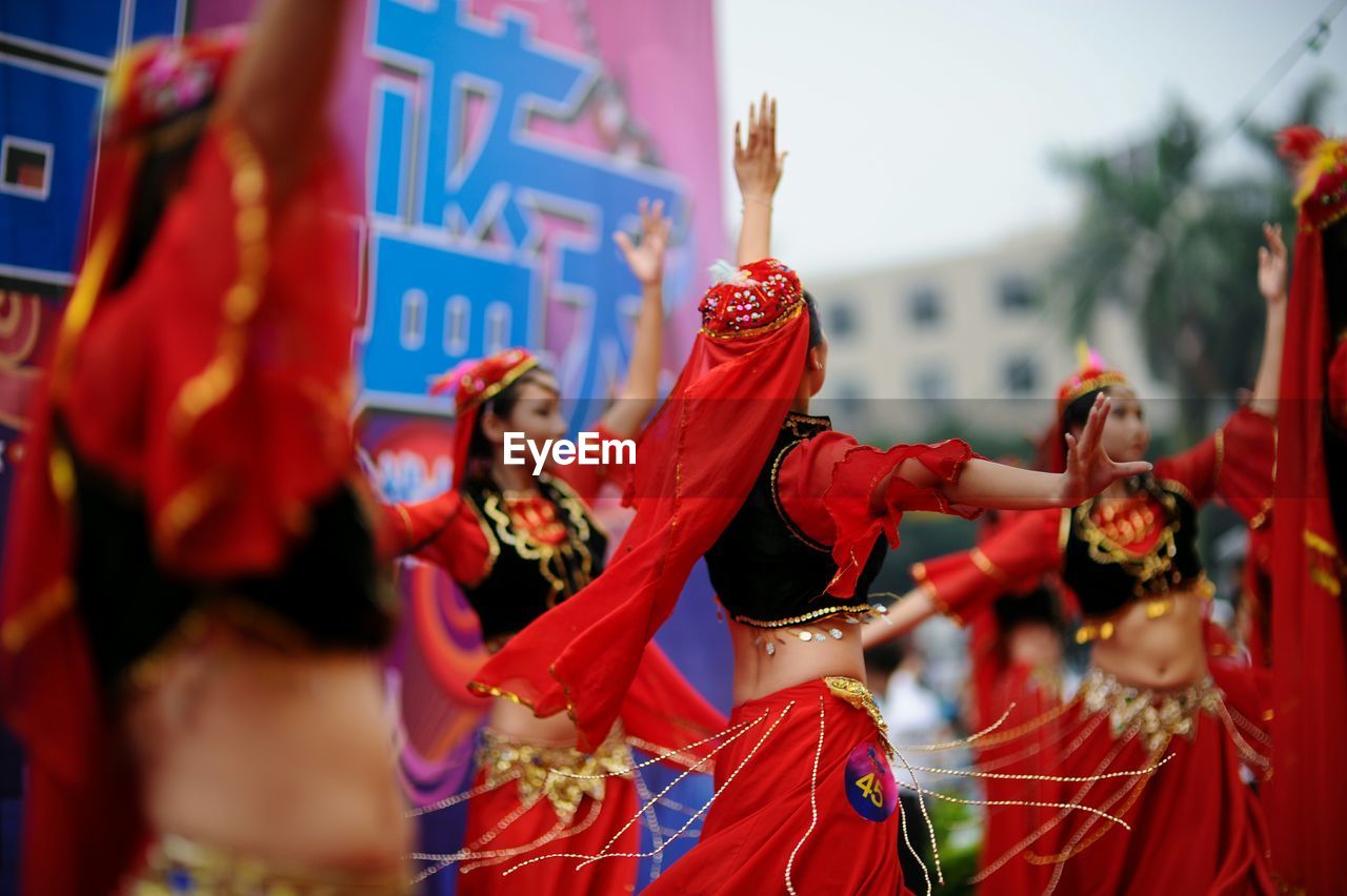 Group of young women dancing outdoors