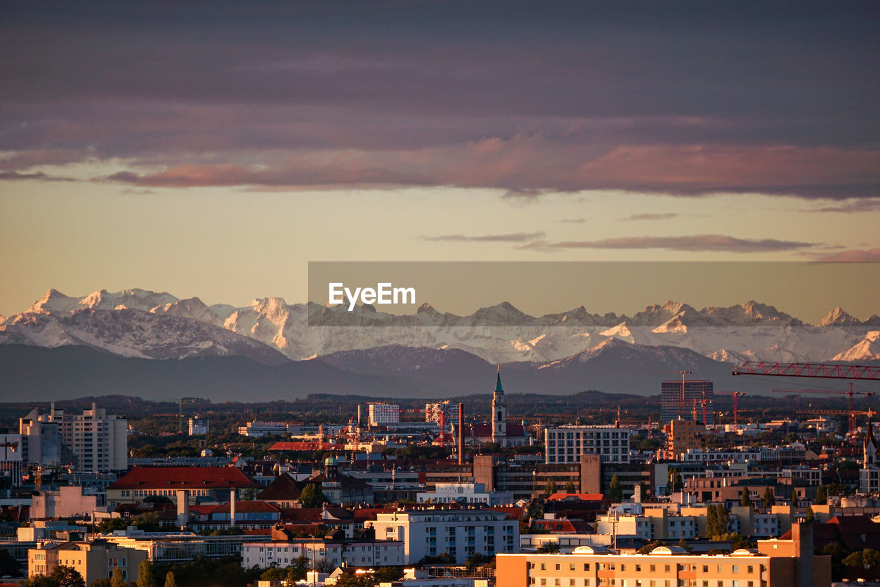 Cityscape against sky during sunset