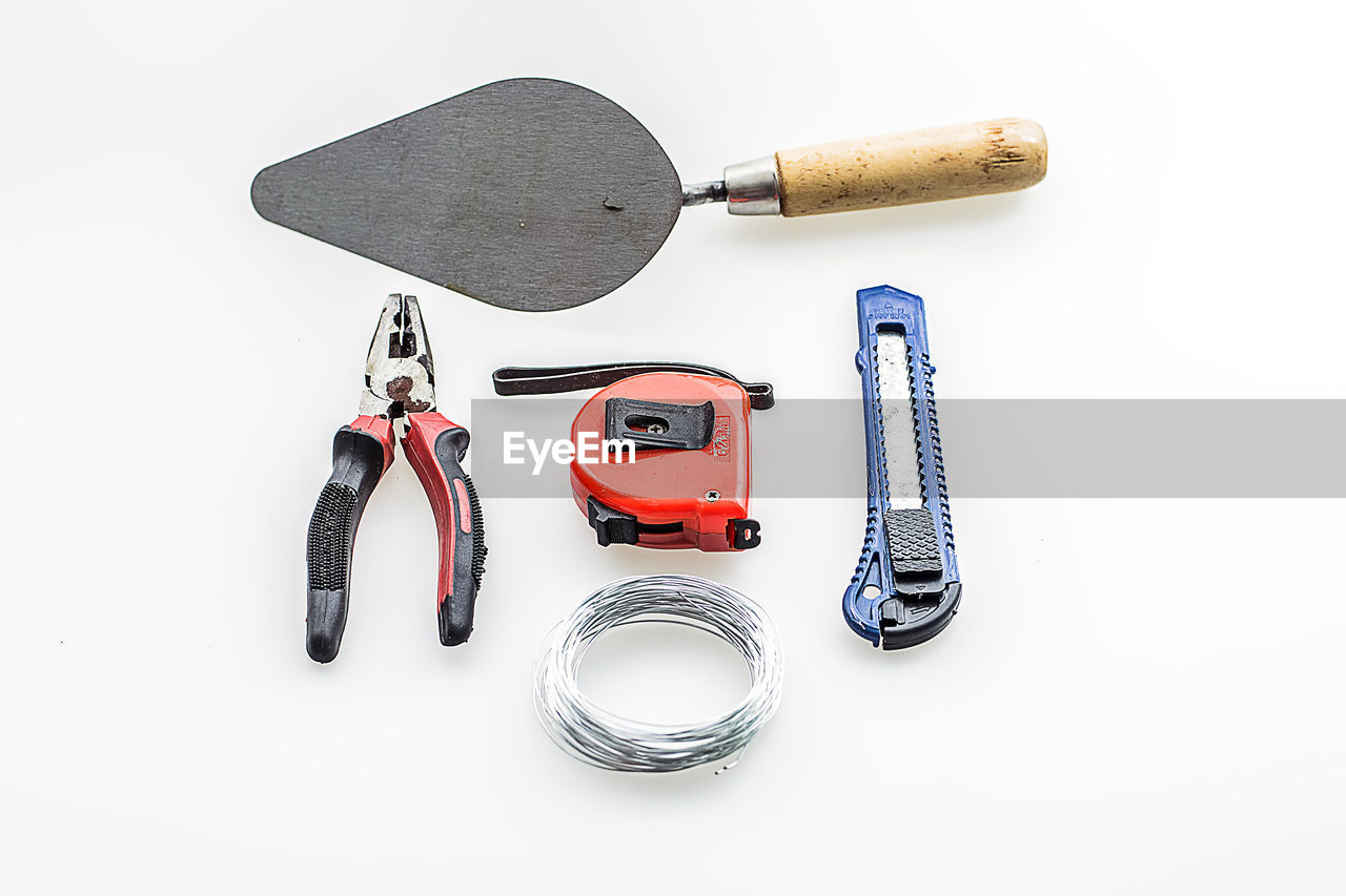 High angle view of work tools on white background