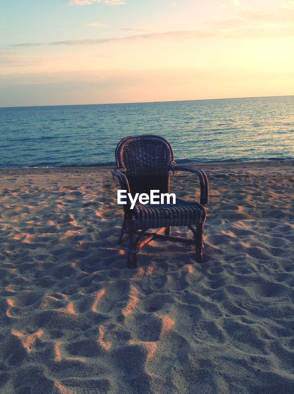 View of empty chair on beach