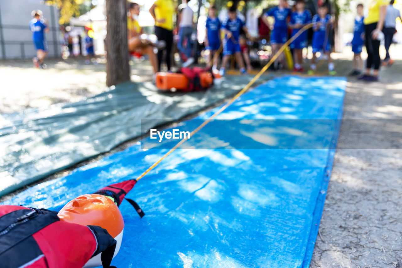 Lifeguard rescue course with training water drowning dummy