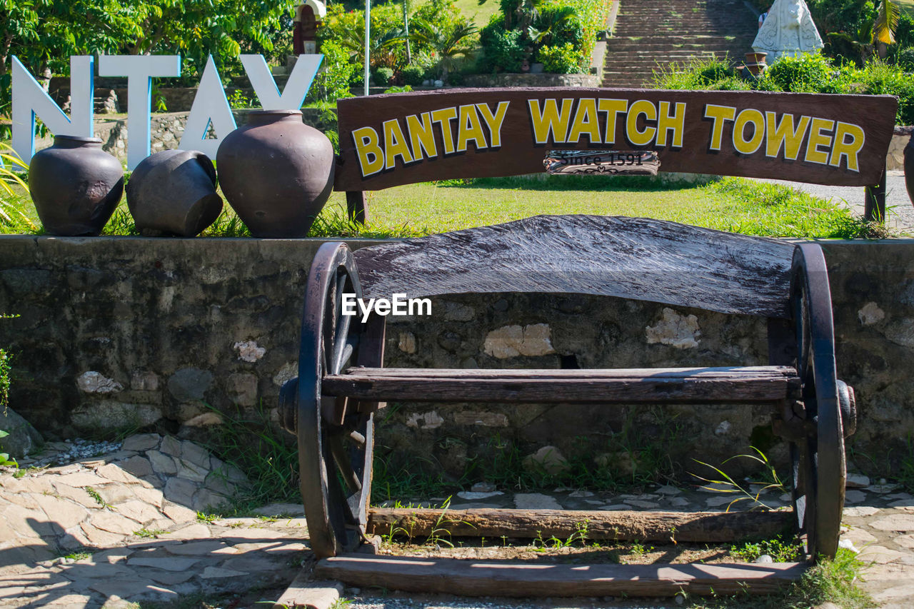 CLOSE-UP OF TEXT ON BENCH